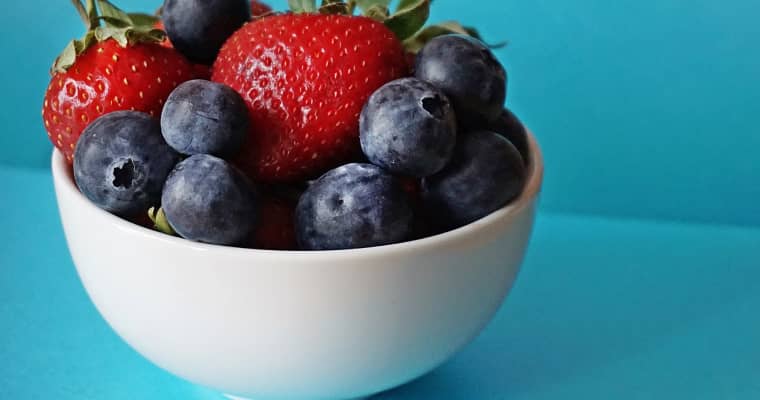 Bowl of fresh strawberries and blueberries.