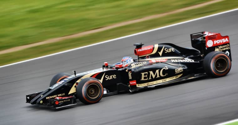 Black and gold Formula 1 car on track.