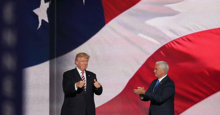 Trump and Pence in front of US flag.