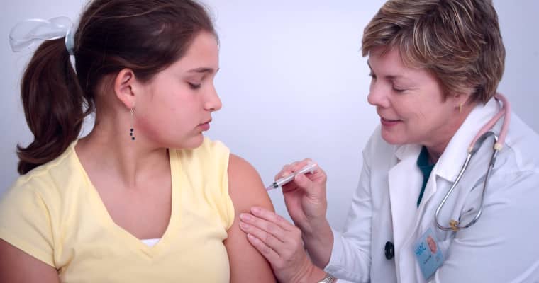 A Woman Getting A Vaccine Done By A Doctor Image