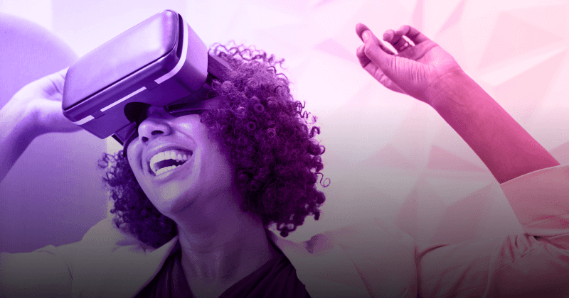 Woman in VR headset smiling and gesturing.